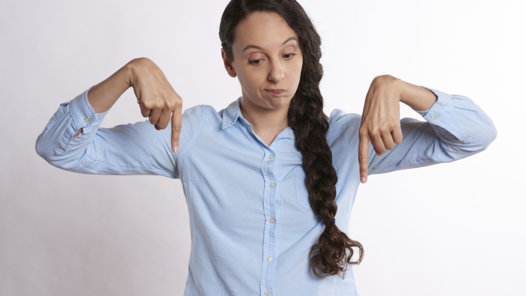 A person making a gesture with both hands