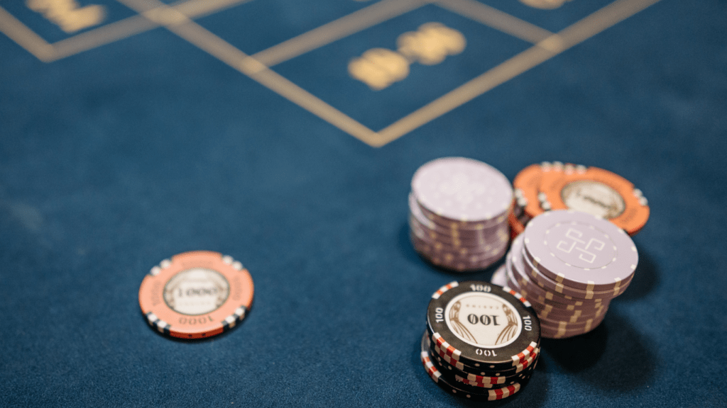 a casino table with chips and a roulette wheel