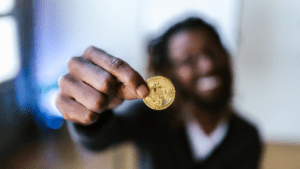 a person holding a bitcoin