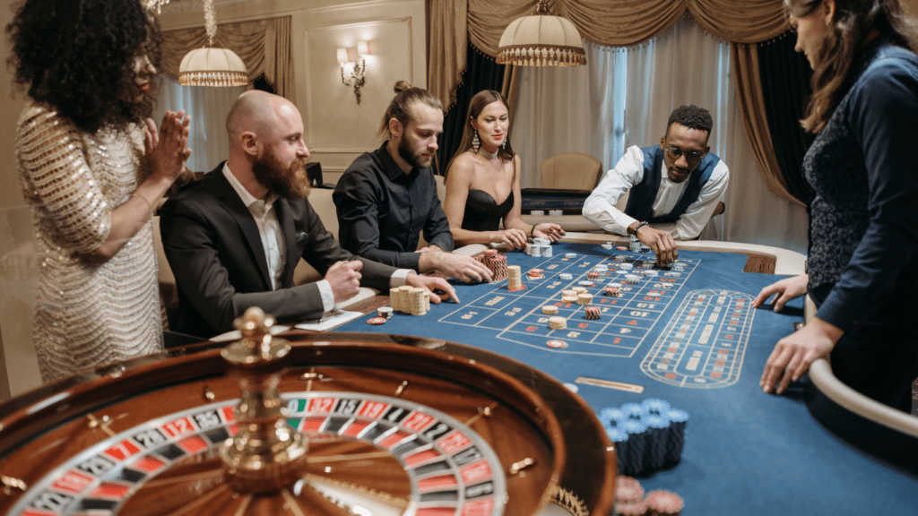 a group of people playing roulette at a casino table