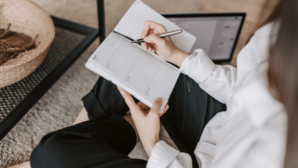 woman writing in her notebook