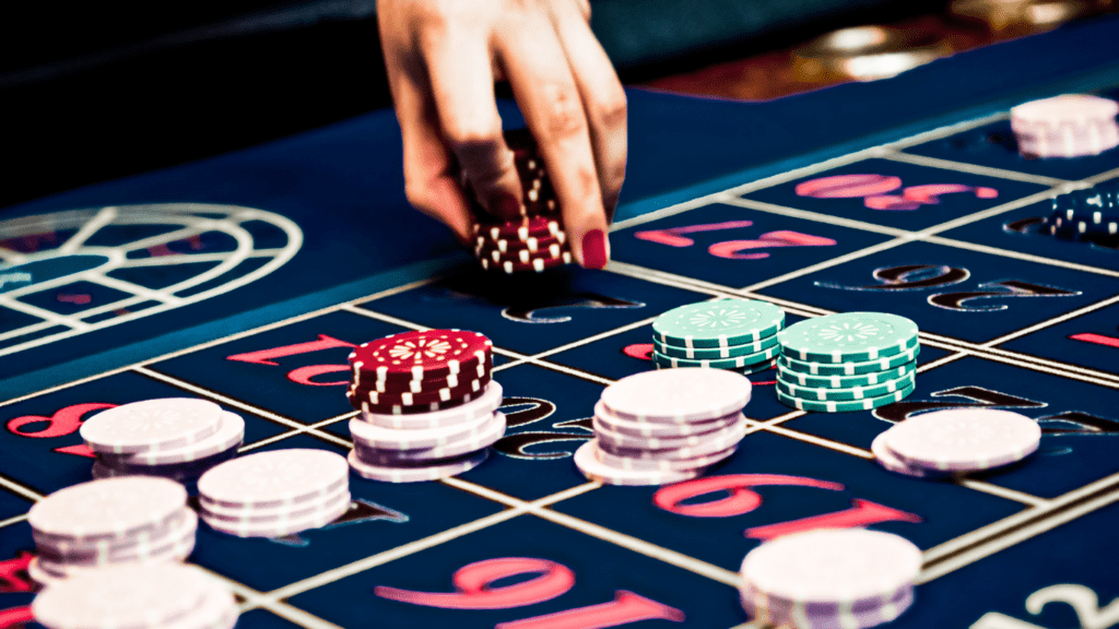 a casino table with chips and a roulette wheel