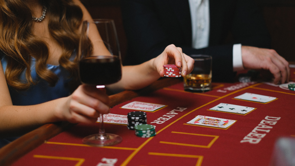 a group of people playing blackjack at a casino table