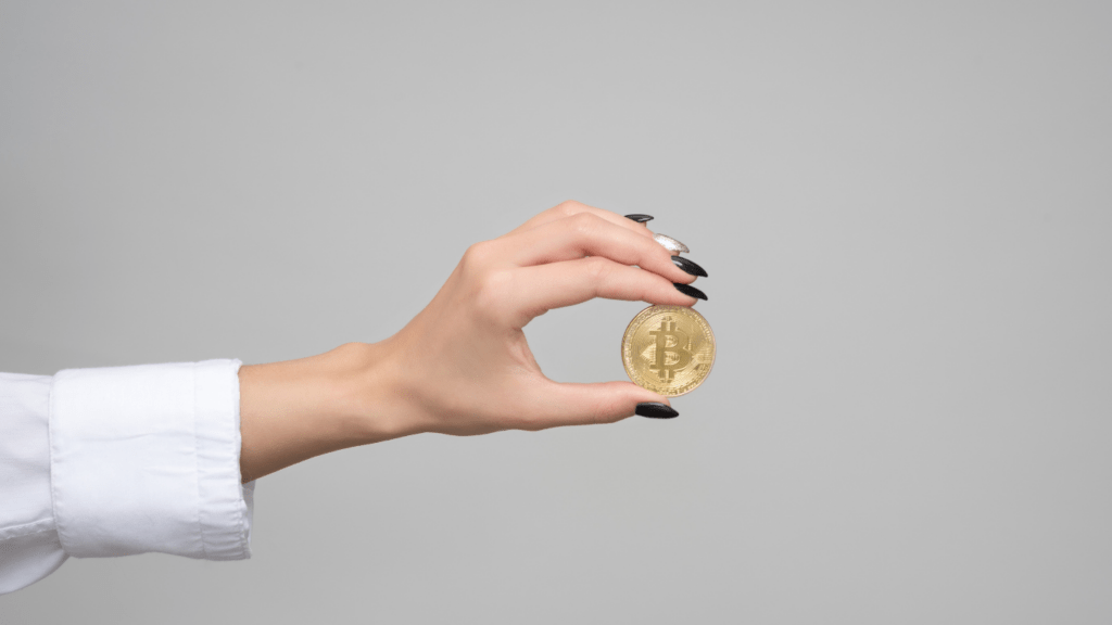 a person holding a bitcoin