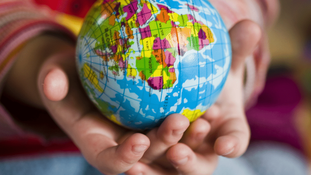 a person holding a globe