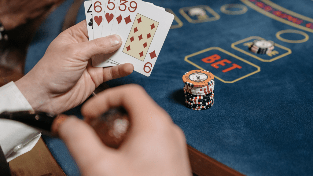 a person playing poker at the casino