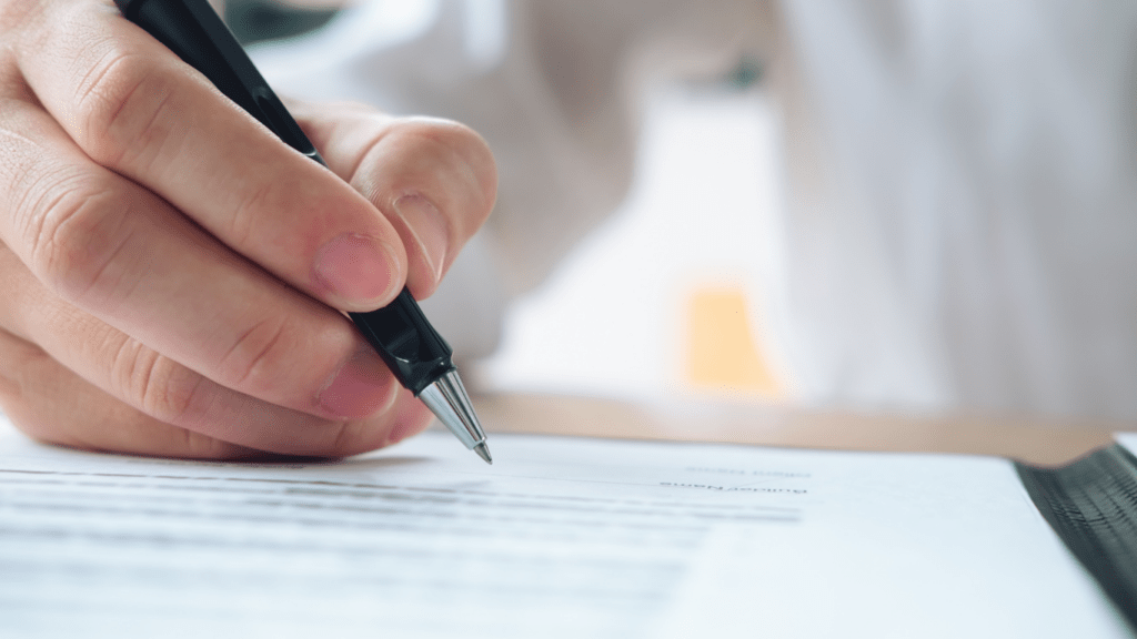 a person signing a contract