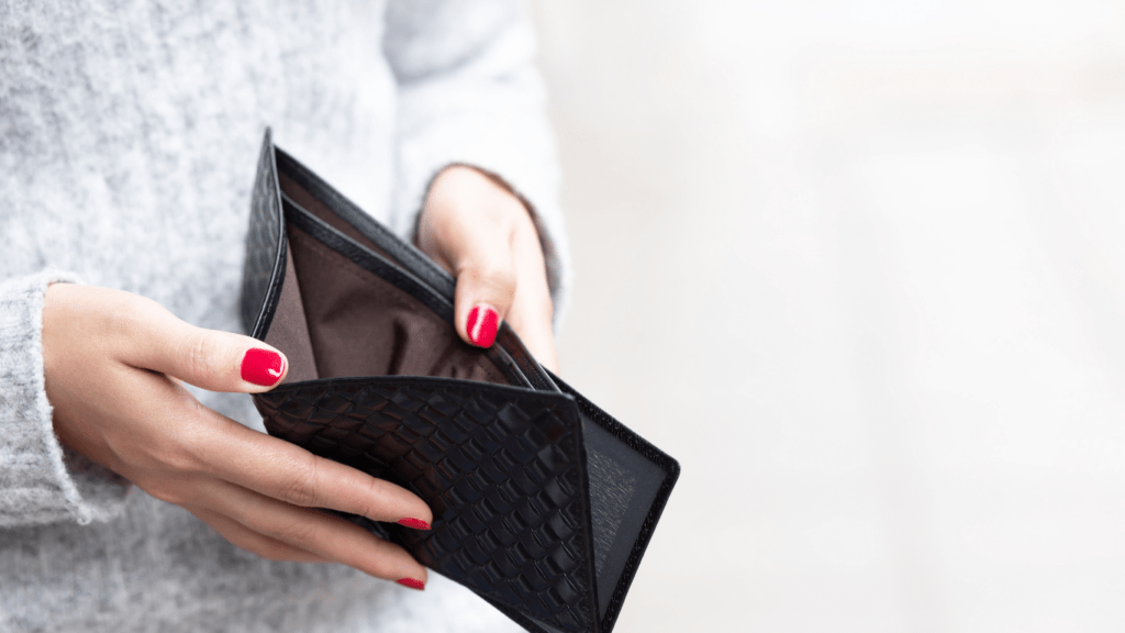 image of a person holding a wallet